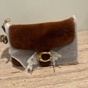 COACH Designed with a sophisticated BrassWarm Brown tabby